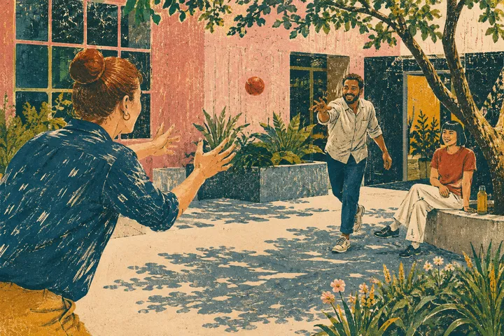 Colleagues play catch in a courtyard outside their workplace.